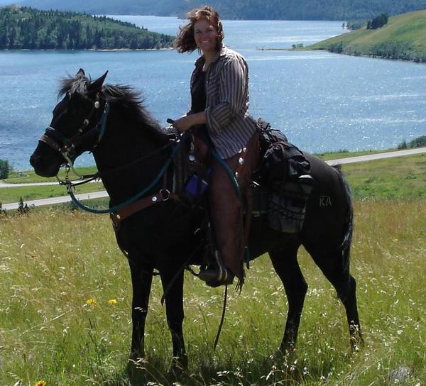 Blackjack and me on holidays at Waterton National Park.  Waterton Lake in the background.  My most favorite place to ride in the mountains of Alberta.