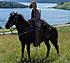 Blackjack and me on holidays at Waterton National Park.  Waterton Lake in the background.  My most favorite place to ride in the mountains of Alberta.
